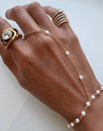 Naya Pearl Hand Chain Bracelets by BRACHA