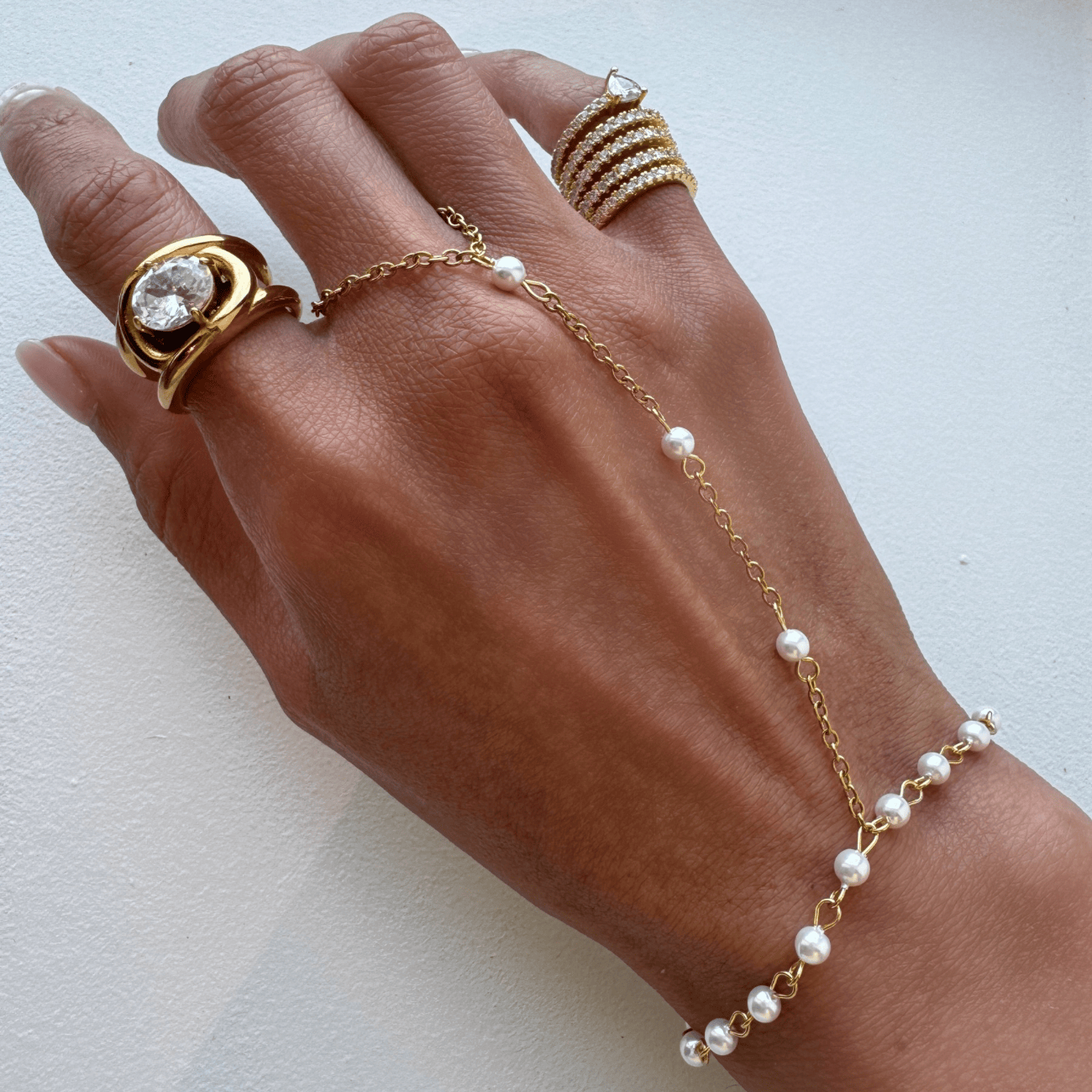 Naya Pearl Hand Chain Bracelets by BRACHA